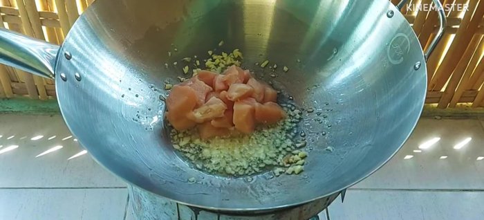 Add onion to the garlic and stir-fry.