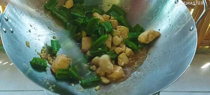 Add the blanched winged beans and stir-fry everything together until heated through.
