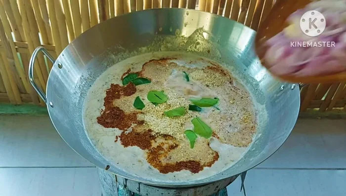Add lime leaves, torn lemongrass, and sliced shallots. Mix well.