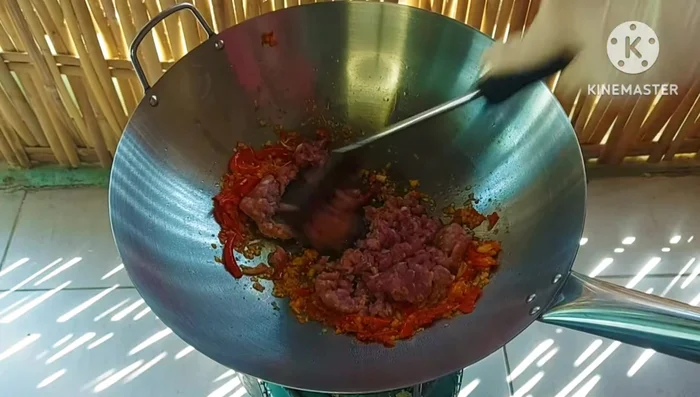 Add minced pork and stir-fry until cooked.