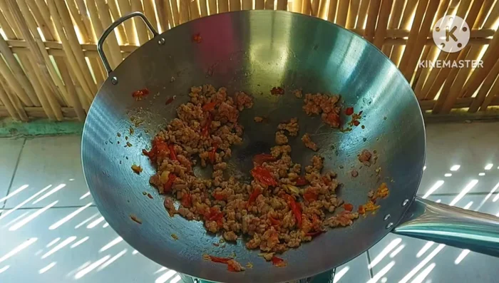 Add glass noodles and a little water to help them cook and thicken the sauce.