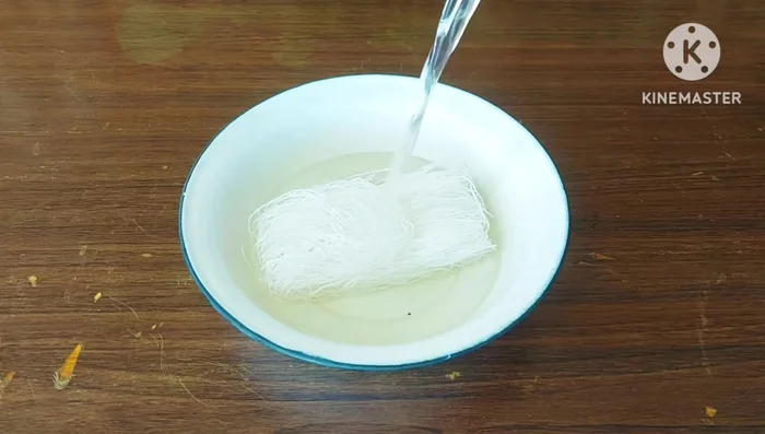 Soak glass noodles in water until soft. Set aside.