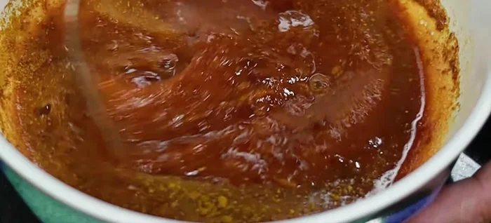 Add curry powder and evaporated milk to the sauce mixture. Mix thoroughly.