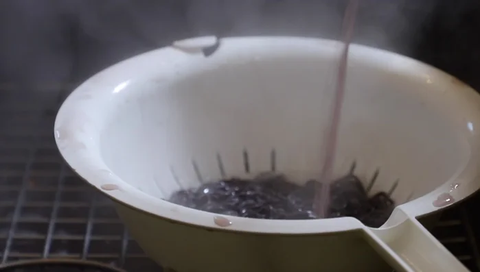Drain and rinse noodles with cold water.