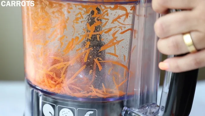 Shred carrots using a food processor or buy pre-shredded carrots.