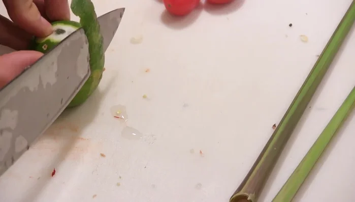 Cut two thin strips of lime peel and add them to the vegetable stock in a separate pot. This will infuse the broth with lime flavor. Bring to a boil and let it reduce by half.