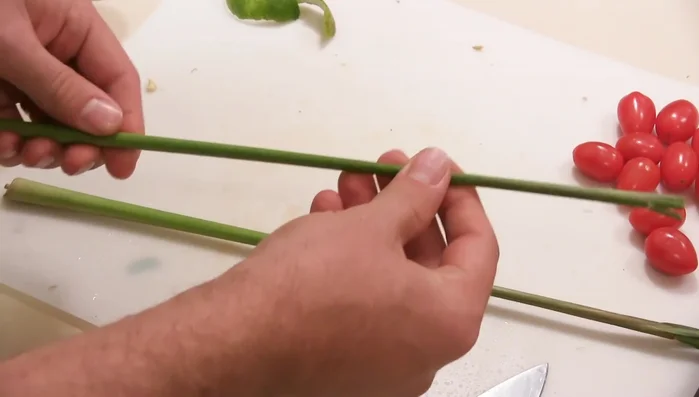 Prepare the lemongrass: Use a knife to score the lemongrass stalks lengthwise, exposing the tender inner flesh. Discard the tough outer layer and finely dice the tender part.