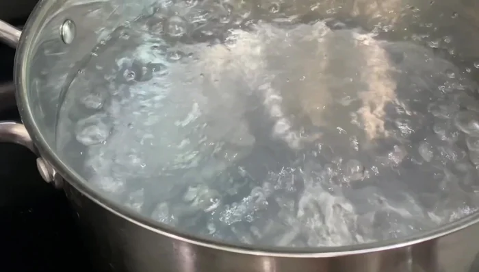 Prepare the seafood by boiling water in a pot on high heat. Once boiling, add seafood and stir. Cook for about 30 seconds until fish balls float to the top. Remove seafood, shake off excess water, and set aside to cool.
