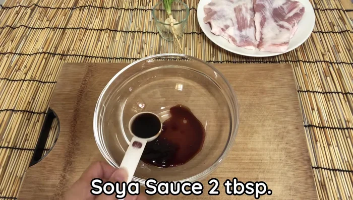 Prepare the marinade: In a bowl, combine soy sauce, fish sauce, palm sugar, black soy sauce, baking soda, and white pepper. Mix well until the palm sugar dissolves.