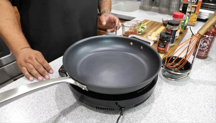 In the same pan, heat the strained chili oil over medium heat. Add soy sauce and chili paste, whisk to combine and heat through.