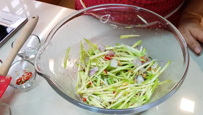 Mix well. Add more sugar and/or fish sauce if needed to balance the sourness.