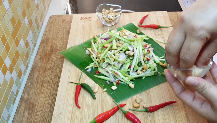 Garnish with remaining chili and dried prawns.