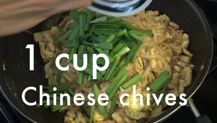 Add Chinese chives, bean sprouts, and stir for 2 minutes.
