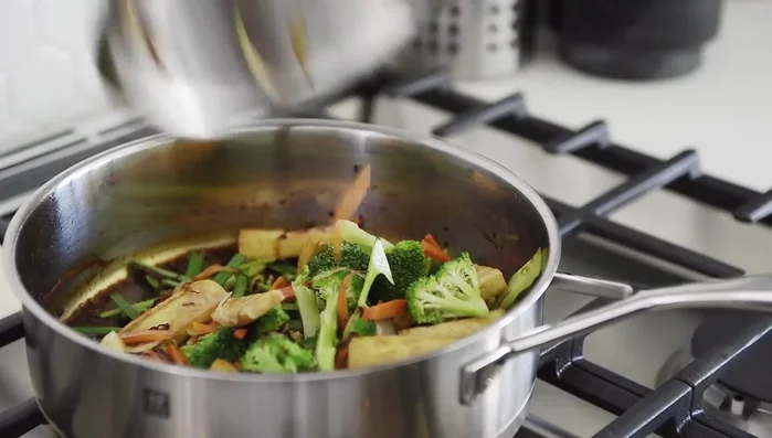 Add chives, veggies, and noodles. Stir for 3-5 minutes (144.39).