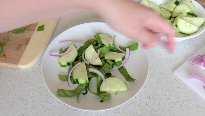 Layer the salad: Start with lettuce, then add cucumbers, red onion, cilantro, and tomatoes. Repeat layers. Top with the cooked beef and dressing.