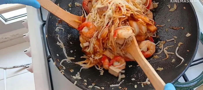 Add half of the Pad Thai sauce.