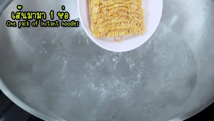 Boil the instant noodles until they are slightly softened, but not fully cooked. Set aside.