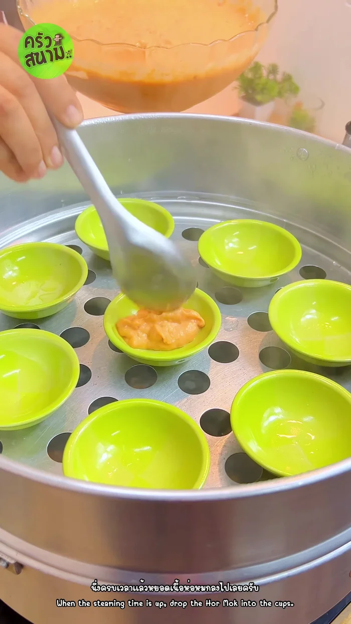 Fill the cups: Add the fish curry mixture to the preheated cups.