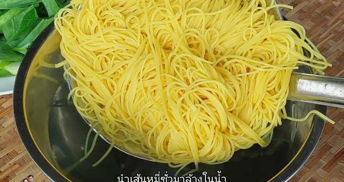 Rinse the cooked noodles under cold water until they are loosened and no longer sticky. Rinse again to remove excess salt.
