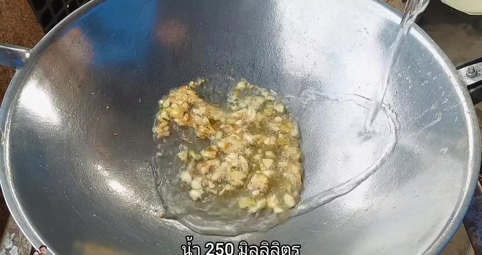 Add water (250ml) to the wok.