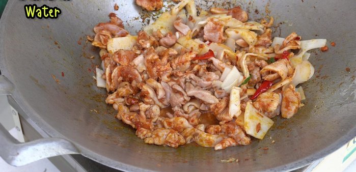 Add water, fish sauce, green soy sauce, oyster sauce, and sugar. Stir-fry until well combined.