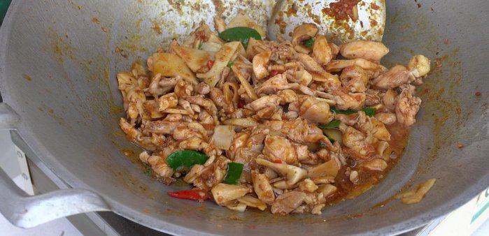 Add basil leaves and stir-fry until wilted.
