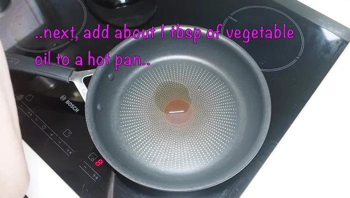 Heat 1 tbsp of vegetable oil in a hot pan. Add the prepared vegetables and stir-fry for about 2 minutes.