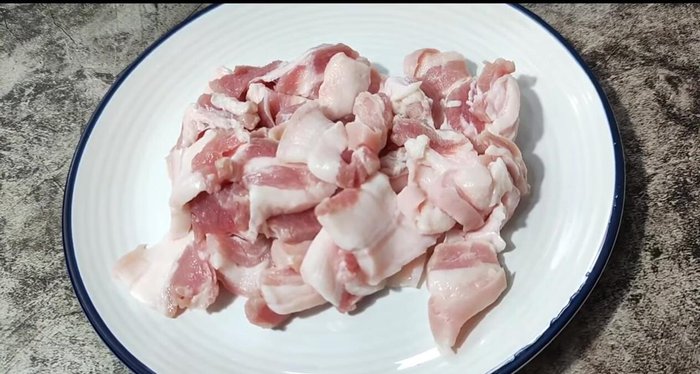 Thinly slice the pork belly.