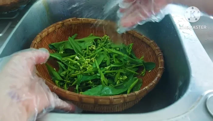 Wash the kale thoroughly and blanch it in boiling salted water until cooked. This helps preserve its green color and reduces cooking time later.