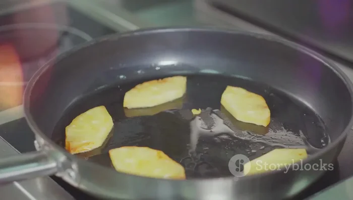 Add pineapple and seasonings: Add pineapple chunks, fish sauce, soy sauce, tamarind paste, and palm sugar. Stir-fry until pineapple is slightly caramelized and the flavors are well combined.