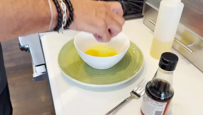 Whisk three eggs together until light and fluffy. This incorporates air for a fluffier omelette.