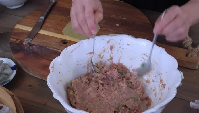 Prepare ravioli: Place a teaspoon of stuffing on a ravioli sheet, fold, and shape.