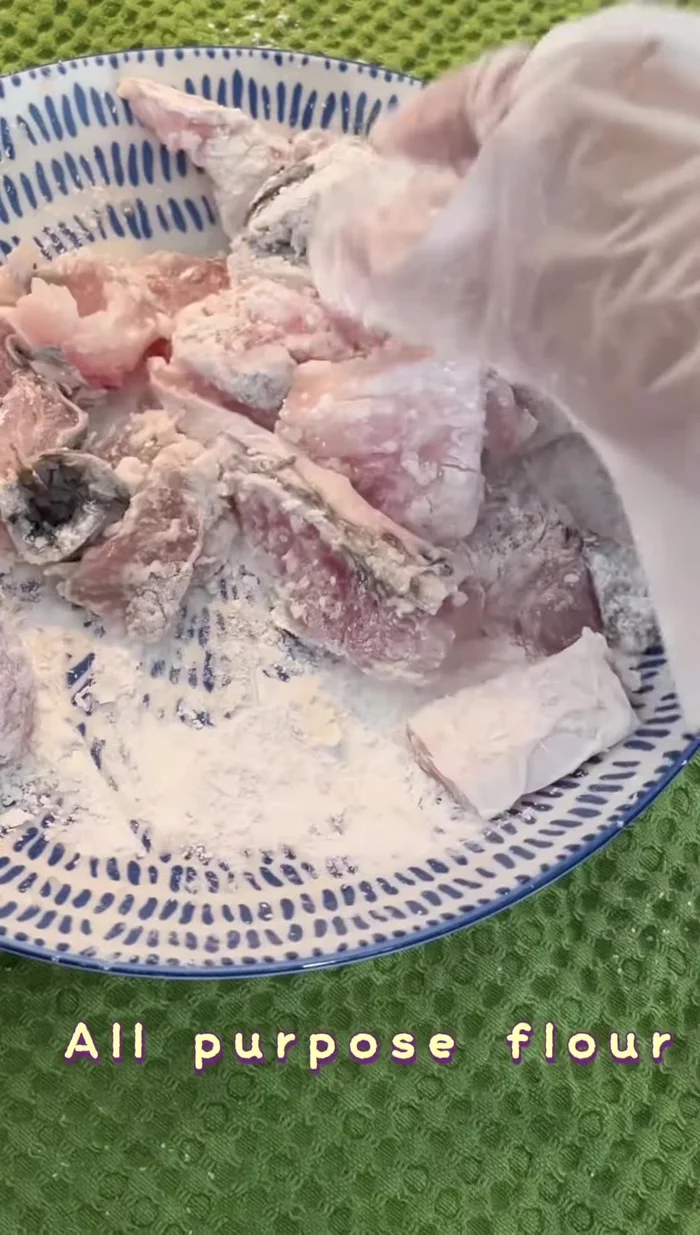 Prepare fried fish: Coat fish in all-purpose flour and fry until crispy.
