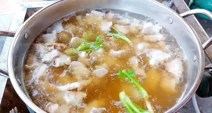 Add coriander root (optional) and chopped garlic.