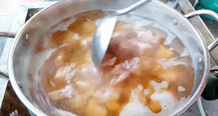 Add the pork cartilage. Skim off any white foam that rises to the surface.