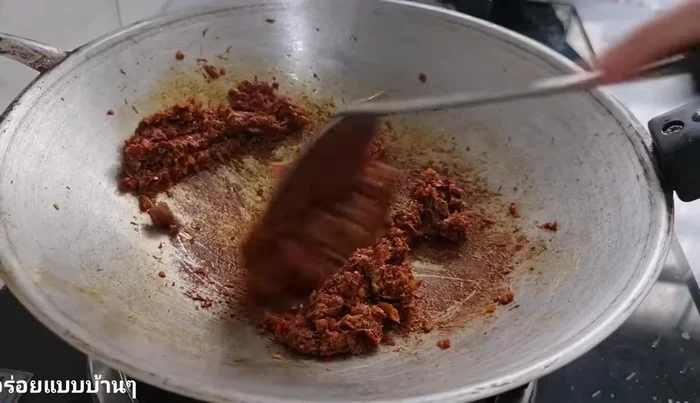 Add pre-cooked minced fish and stir-fry until well combined.