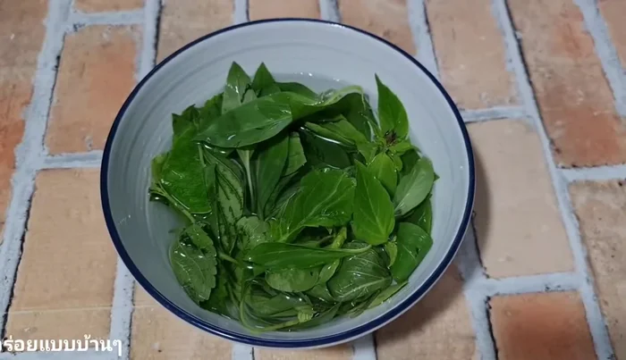 Mix basil and dill leaves, wash, and soak in water.