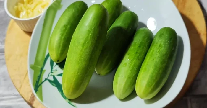 Prepare the cucumbers. Wash and cut 7-8 cucumbers into desired shapes (rounds or sections).