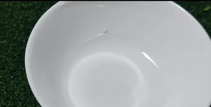 Crack 2 chicken eggs into a cup.