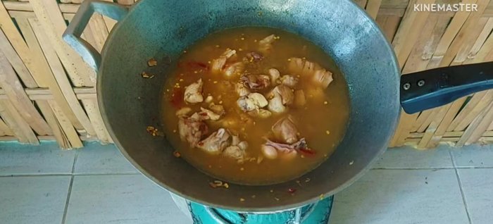 Add the fragrant flowers and lime leaves. Simmer until the chicken is cooked through and the flavors have melded.