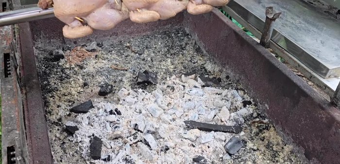 Cook the chicken on a rotisserie over medium heat, then reduce to low heat. Add more charcoal as needed. This takes approximately 2 hours.