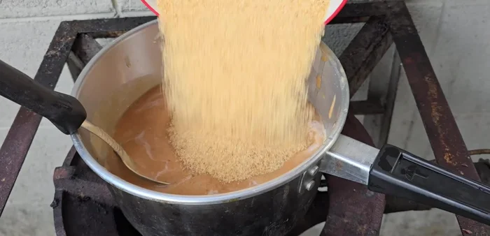 Prepare the dipping sauce by combining all ingredients in a pot and simmering until thickened.