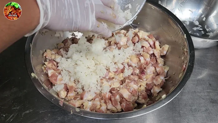 Add the sticky rice and continue kneading for another 10-15 minutes until sticky and well combined.