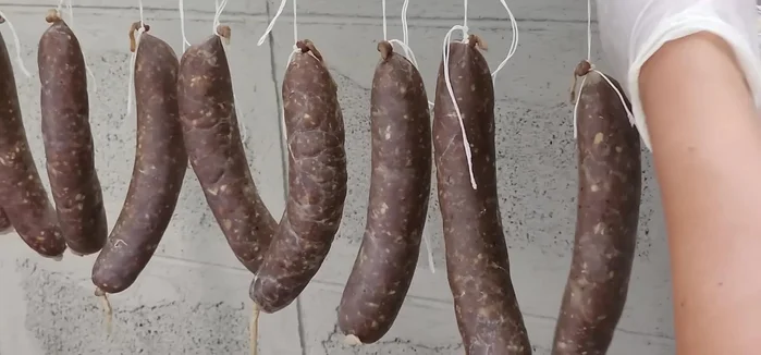Hang the Isan ham to dry in a well-ventilated area, either in the sun or shade. The drying process can take a few days.
