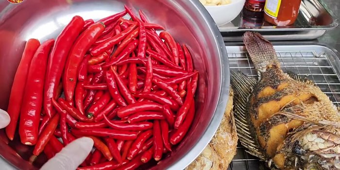Prepare the chili sauce: Blend or chop red chili peppers and garlic.