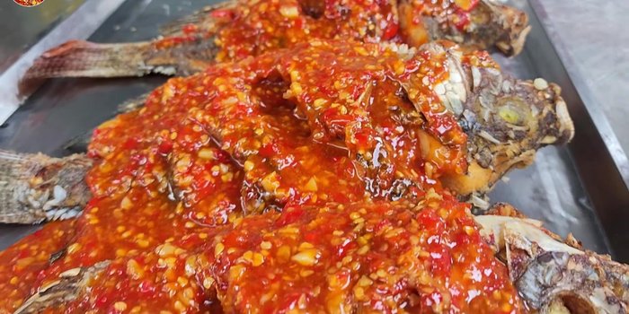 Pour sauce over fried tilapia.
