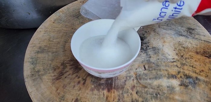 Mix the cooked sticky rice, rice flour, tapioca flour, and sugar together.