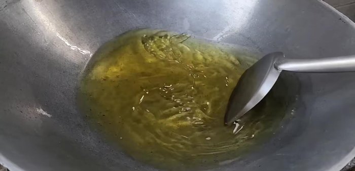 Heat vegetable oil in a pan over medium-low heat.
