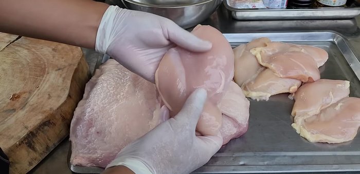 Cut pork into strips, following or against the grain. Cut chicken breast into similarly sized pieces.