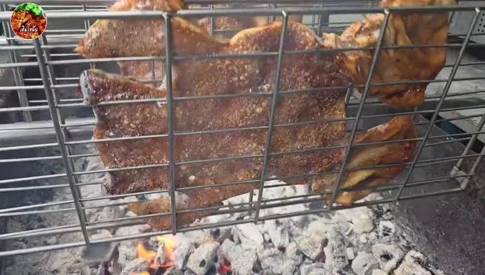 Grill until the skin puffs up and turns yellow and crispy, turning it every 2-3 times, about 40 minutes total.